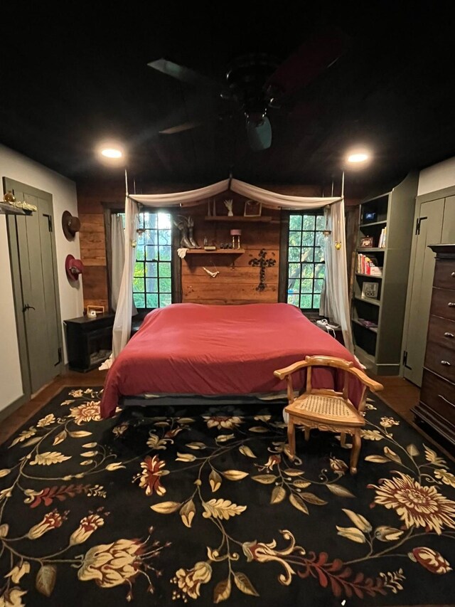 805 Trenton St, Weatherford, TX 76086 - bedroom featuring wood walls and wood finished floors