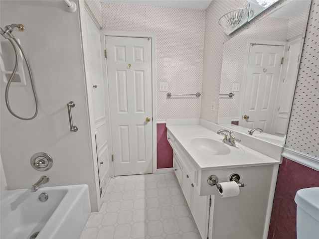 full bath with wallpapered walls, vanity, and shower / bathtub combination