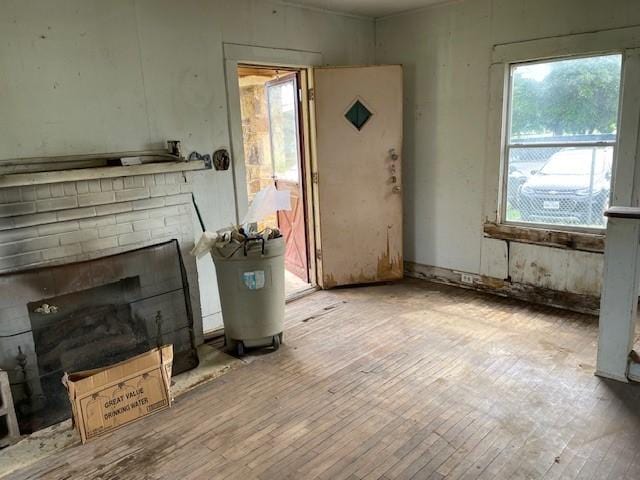 unfurnished living room featuring hardwood / wood-style floors and a fireplace