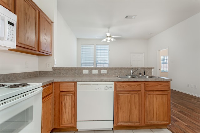 1727 Preston On The Lake Blvd, Little Elm, TX 75068 - kitchen featuring white appliances, a sink, a peninsula, light wood finished floors, and ceiling fan