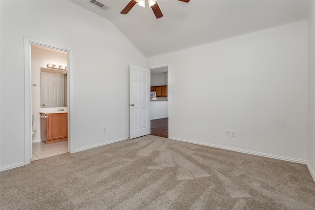 1727 Preston On The Lake Blvd, Little Elm, TX 75068 - unfurnished bedroom featuring light carpet, vaulted ceiling, baseboards, ensuite bathroom, and a ceiling fan