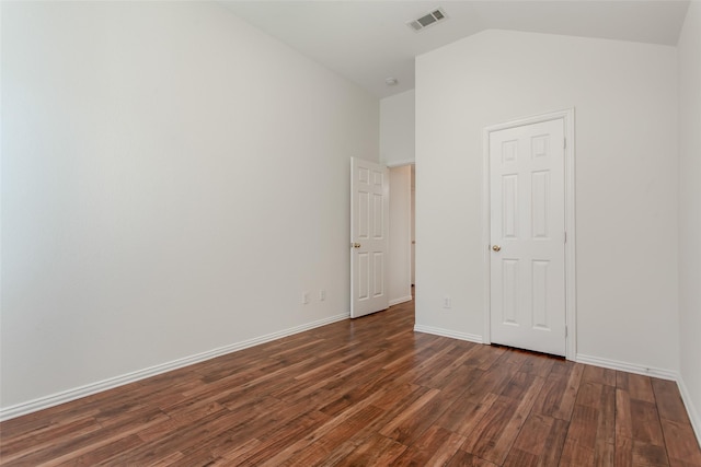 1727 Preston On The Lake Blvd, Little Elm, TX 75068 - unfurnished bedroom with dark wood-style floors, lofted ceiling, and baseboards
