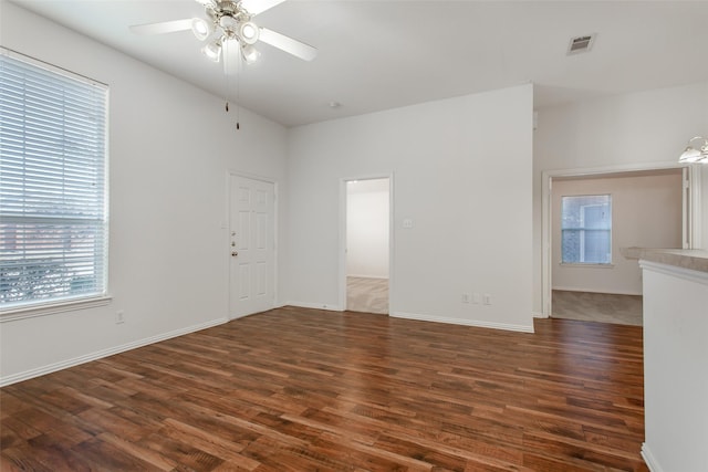 1727 Preston On The Lake Blvd, Little Elm, TX 75068 - unfurnished living room featuring plenty of natural light, wood finished floors, ceiling fan, and baseboards