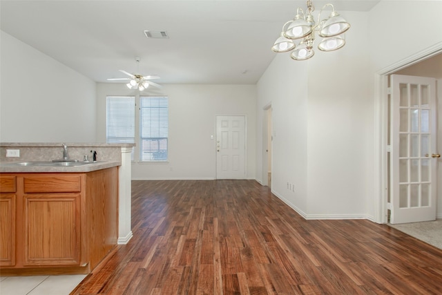 1727 Preston On The Lake Blvd, Little Elm, TX 75068 - kitchen featuring dark wood-style flooring, a sink, baseboards, light countertops, and a chandelier