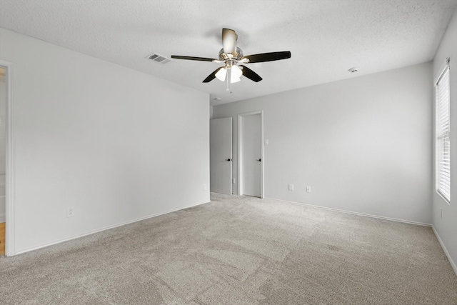 3110 Legend Dr, Mckinney, TX 75070 - spare room with a ceiling fan, carpet flooring, a textured ceiling, and baseboards