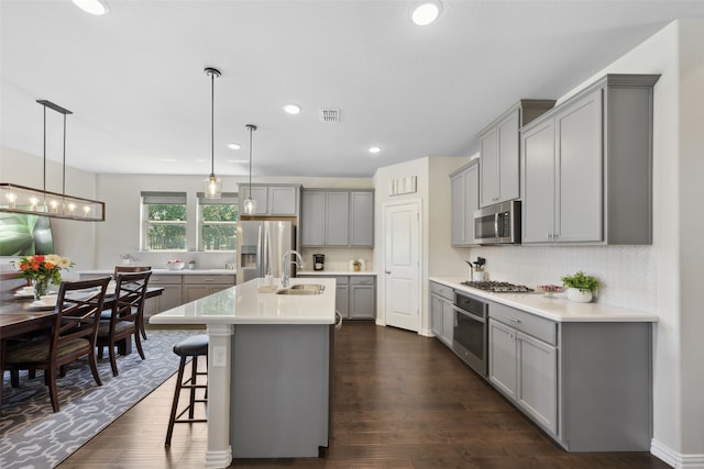 216 Shadow Creek Ln, Hickory Creek, TX 75065 - kitchen with gray cabinetry, stainless steel appliances, dark wood-style flooring, and recessed lighting
