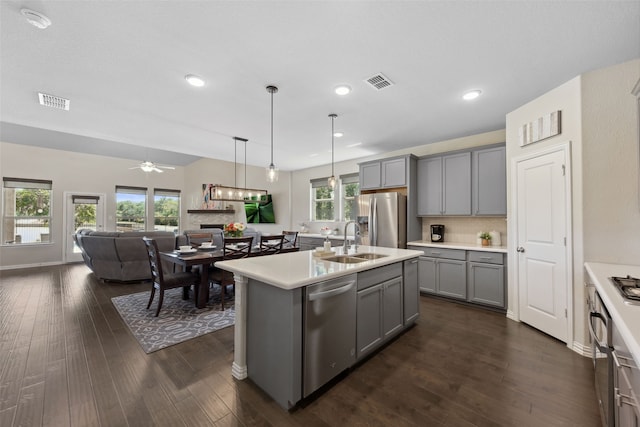 216 Shadow Creek Ln, Hickory Creek, TX 75065 - kitchen featuring gray cabinets, appliances with stainless steel finishes, a sink, light countertops, and recessed lighting