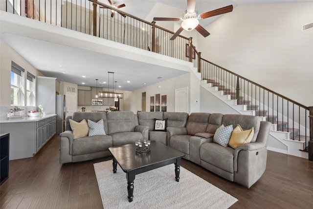 216 Shadow Creek Ln, Hickory Creek, TX 75065 - living room with ceiling fan, a high ceiling, stairway, and dark wood-style floors