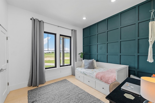1197 Prairie Chapel Rd, Crawford, TX 76638 - sitting room featuring a decorative wall, recessed lighting, light wood finished floors, and baseboards