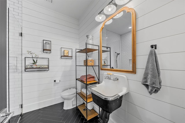1197 Prairie Chapel Rd, Crawford, TX 76638 - full bath with toilet, a tile shower, wood walls, and tile patterned floors