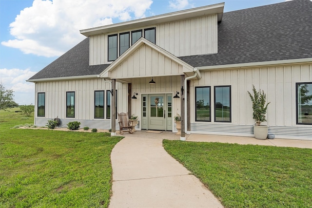 1197 Prairie Chapel Rd, Crawford, TX 76638 - view of front facade featuring a shingled roof, a front lawn, and board and batten siding