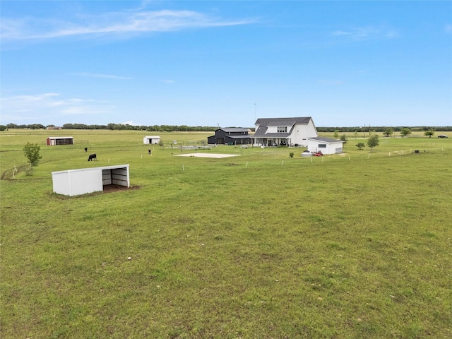 1197 Prairie Chapel Rd, Crawford, TX 76638 - view of green lawn featuring an outbuilding and a view of rural / pastoral area