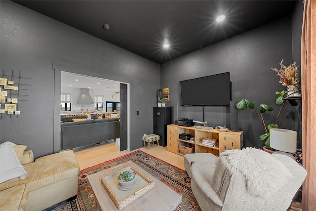 1197 Prairie Chapel Rd, Crawford, TX 76638 - living room featuring wood finished floors and recessed lighting