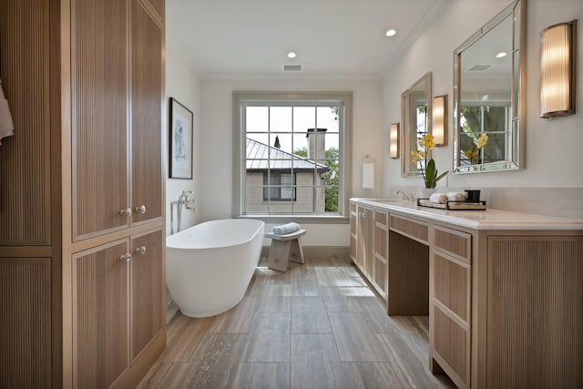 3626 University Blvd, University Park, TX 75205 - full bathroom with a freestanding tub, vanity, wood finished floors, and recessed lighting