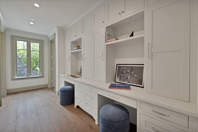 3626 University Blvd, University Park, TX 75205 - office area with built in desk, crown molding, light wood finished floors, recessed lighting, and baseboards