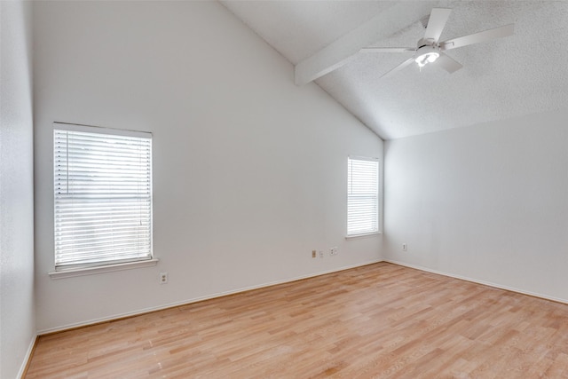 spare room featuring beam ceiling, wood finished floors, a ceiling fan, high vaulted ceiling, and baseboards
