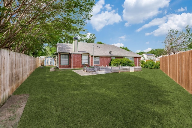 rear view of property featuring a patio area, a storage unit, brick siding, an outdoor structure, and roof with shingles