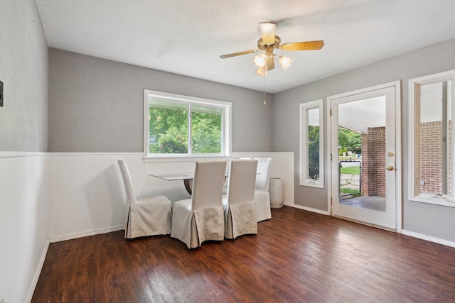 dining room with wood finished floors, baseboards, and a ceiling fan