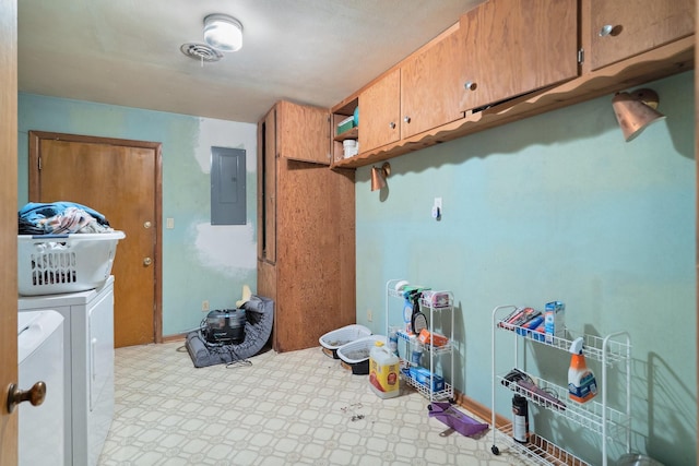 clothes washing area featuring cabinet space, independent washer and dryer, electric panel, and tile patterned floors