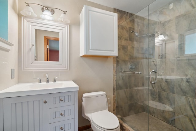 full bath with a shower stall, toilet, and vanity