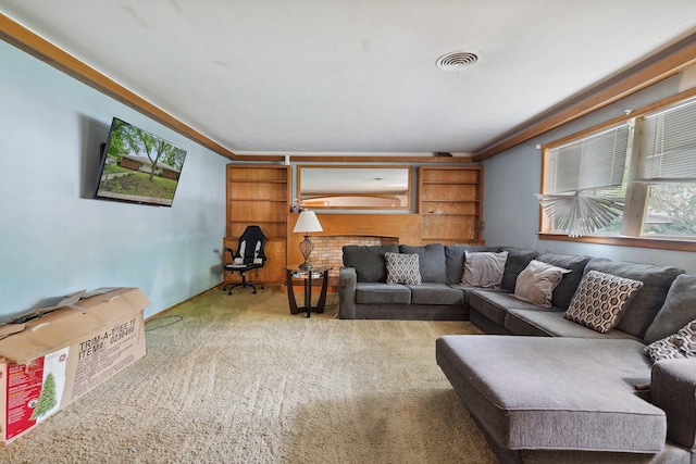 living room with carpet floors and crown molding