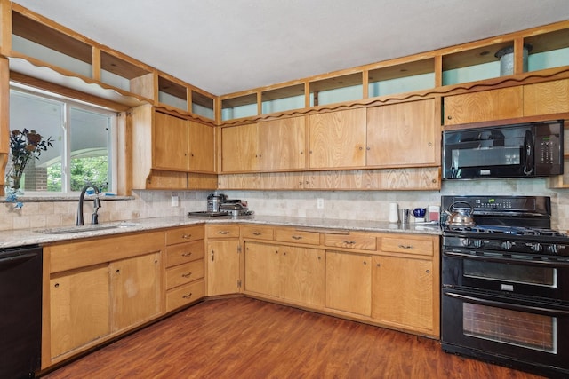 kitchen featuring black appliances, a sink, dark wood finished floors, and backsplash