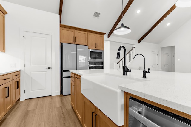 742 Faith Bud Ln, Lavon, TX 75166 - kitchen with appliances with stainless steel finishes, light wood-style floors, hanging light fixtures, light stone counters, and beamed ceiling