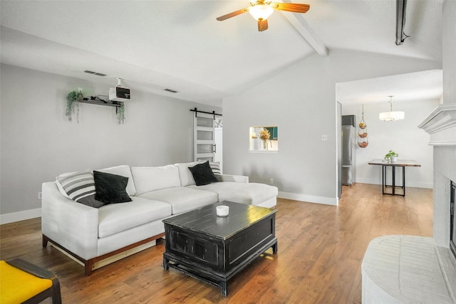5012 Marina Del Rd, Fort Worth, TX 76179 - living room with a ceiling fan, a barn door, a brick fireplace, and wood finished floors