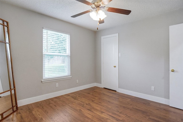 5012 Marina Del Rd, Fort Worth, TX 76179 - unfurnished bedroom featuring wood finished floors, baseboards, a textured ceiling, and ceiling fan