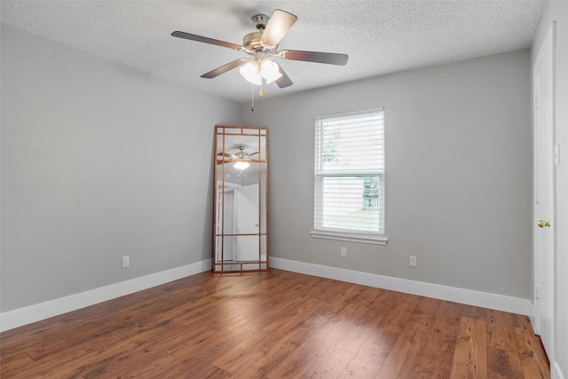5012 Marina Del Rd, Fort Worth, TX 76179 - empty room with wood finished floors, ceiling fan, a textured ceiling, and baseboards