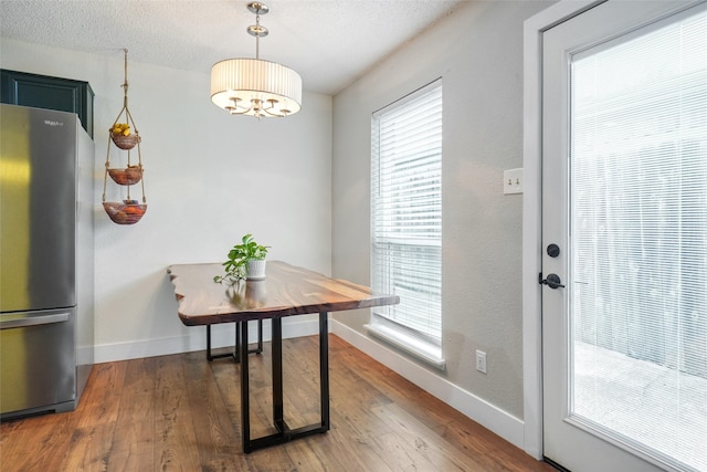 5012 Marina Del Rd, Fort Worth, TX 76179 - doorway to outside with baseboards, wood finished floors, and plenty of natural light