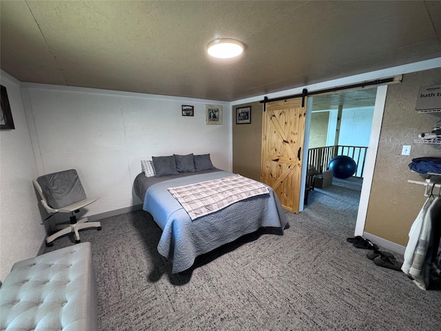 235 Hcr 2128, Whitney, TX 76692 - carpeted bedroom with a barn door, a textured ceiling, and baseboards