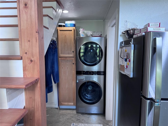235 Hcr 2128, Whitney, TX 76692 - laundry room with stacked washer / drying machine, cabinet space, and crown molding