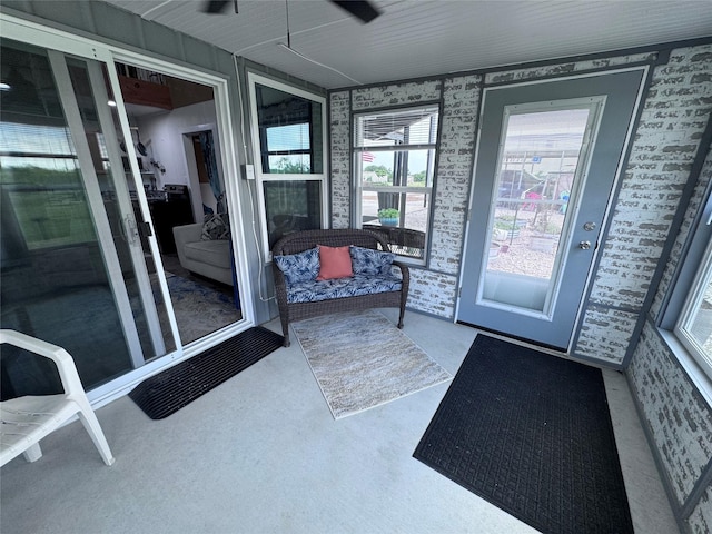 235 Hcr 2128, Whitney, TX 76692 - doorway to outside with plenty of natural light, wallpapered walls, carpet, and a ceiling fan
