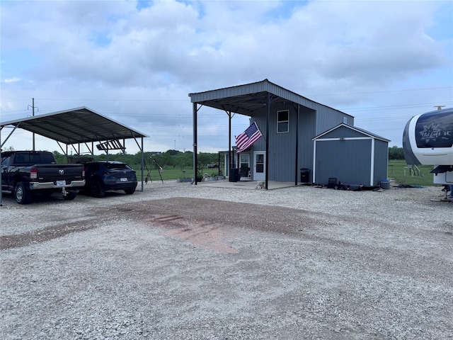 235 Hcr 2128, Whitney, TX 76692 - view of outdoor structure featuring driveway and a detached carport