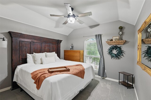 bedroom featuring lofted ceiling, carpet, baseboards, and ceiling fan