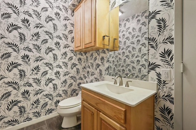 half bath featuring wallpapered walls, toilet, vanity, and tile patterned flooring