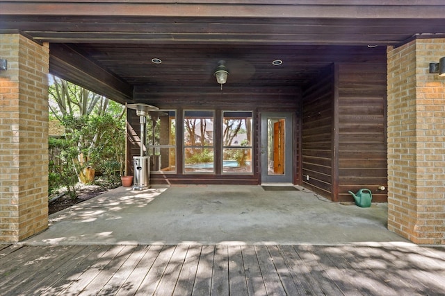 entrance to property featuring a patio area