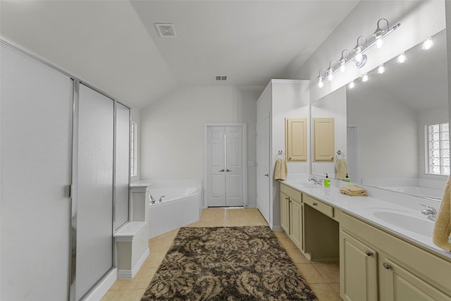 473 Inverness Dr, Fairview, TX 75069 - bathroom featuring vaulted ceiling, tile patterned floors, a garden tub, and double vanity