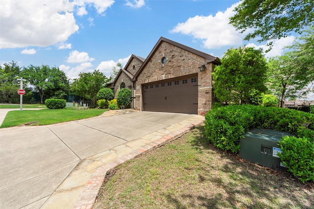 473 Inverness Dr, Fairview, TX 75069 - view of front facade featuring brick siding, concrete driveway, a front yard, and a garage