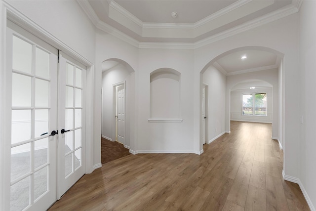 473 Inverness Dr, Fairview, TX 75069 - hall featuring wood finished floors, french doors, baseboards, arched walkways, and ornamental molding