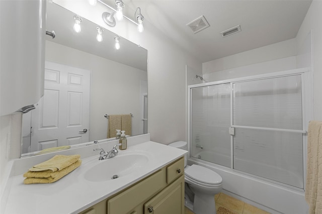 473 Inverness Dr, Fairview, TX 75069 - bathroom featuring toilet, bath / shower combo with glass door, vanity, and tile patterned floors