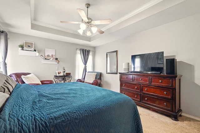 bedroom with a raised ceiling, light carpet, ornamental molding, and a ceiling fan
