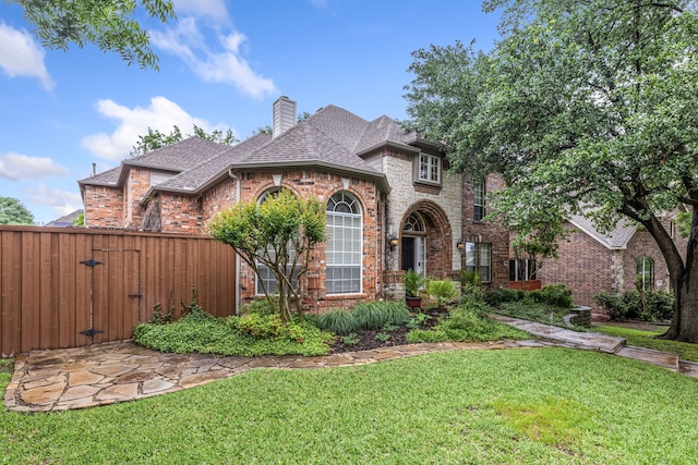 1430 Westmont Dr, Allen, TX 75013 - view of front of home with brick siding, a shingled roof, a gate, and a chimney