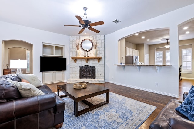 1430 Westmont Dr, Allen, TX 75013 - living room with a ceiling fan, arched walkways, baseboards, a fireplace, and recessed lighting