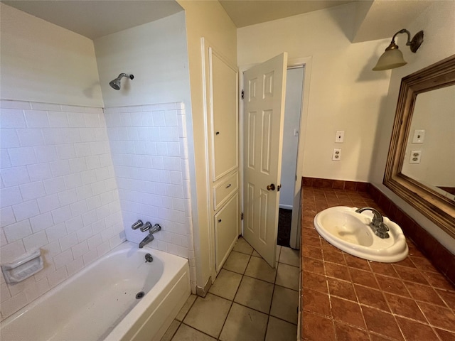 216 E Homewood Dr, Crockett, TX 75835 - bathroom with tile patterned flooring, shower / tub combination, a sink, and baseboards