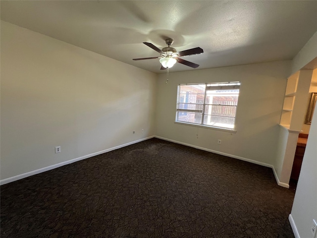 216 E Homewood Dr, Crockett, TX 75835 - empty room with ceiling fan, dark colored carpet, and baseboards