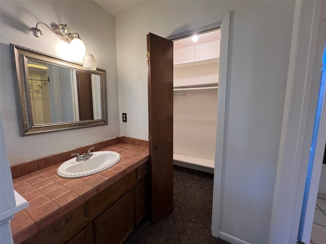 216 E Homewood Dr, Crockett, TX 75835 - bathroom featuring vanity and a spacious closet