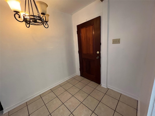 216 E Homewood Dr, Crockett, TX 75835 - foyer featuring a chandelier, light tile patterned floors, and baseboards