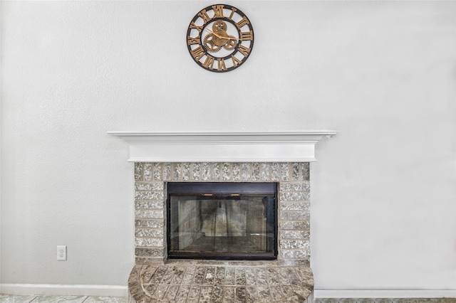 6405 Longmont Trl, Fort Worth, TX 76179 - detailed view of a glass covered fireplace and baseboards